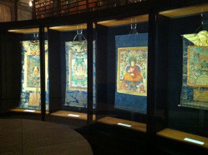 Thankgas displayed in the curved cases on the mezzanine of the Beinecke Rare Book and Manuscript Library 